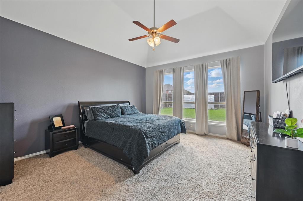 408 Mission Drive Forney, TX 75126 - Photo 14 of 40 Bedroom featuring light colored carpet, baseboards, ceiling fan, and high vaulted ceiling