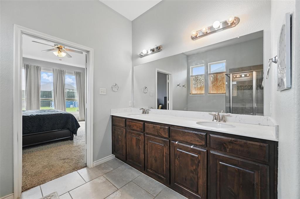 408 Mission Drive Forney, TX 75126 - Photo 16 of 40 Full bathroom with plenty of natural light, double vanity, ensuite bathroom, and tile patterned floors