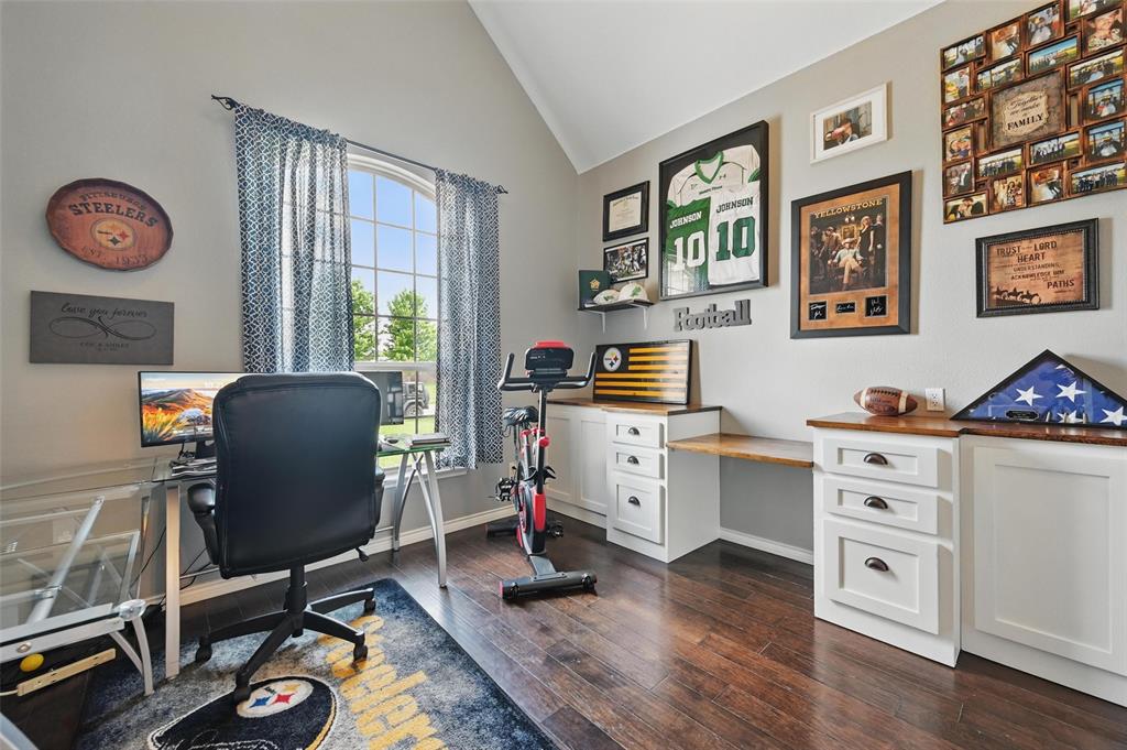 408 Mission Drive Forney, TX 75126 - Photo 20 of 40 Office space with vaulted ceiling, dark wood-type flooring, and baseboards