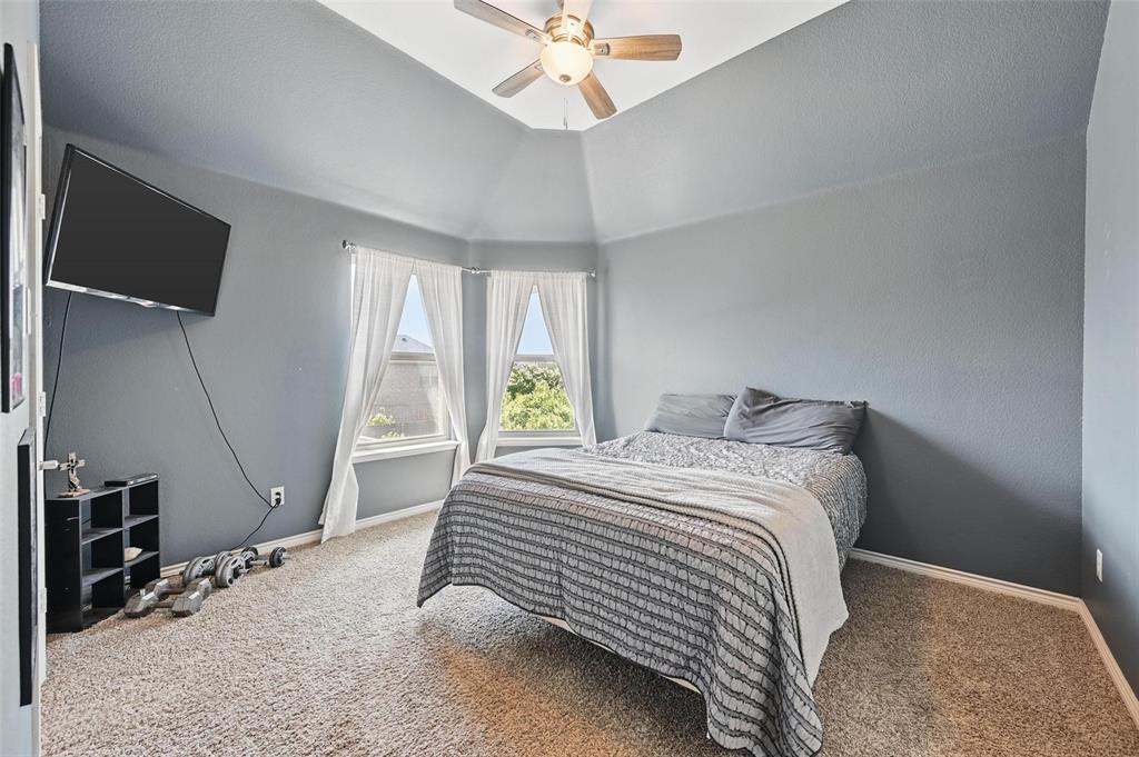 408 Mission Drive Forney, TX 75126 - Photo 24 of 40 Bedroom featuring carpet floors, baseboards, ceiling fan, and high vaulted ceiling