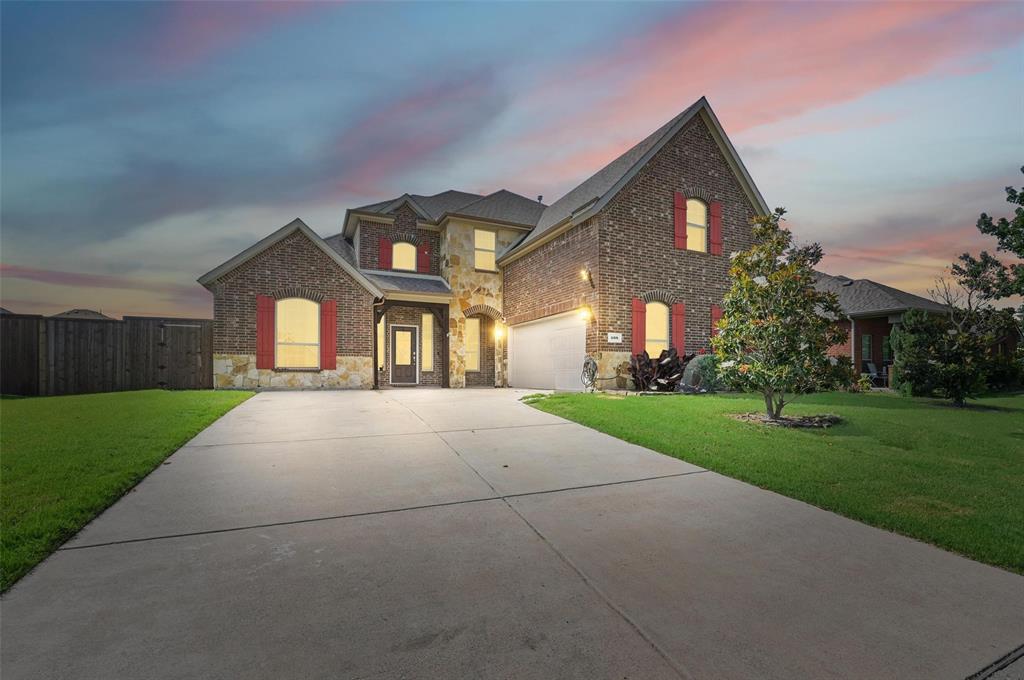 408 Mission Drive Forney, TX 75126 - Photo 37 of 40 Traditional-style home featuring stone siding, concrete driveway, brick siding, and a garage