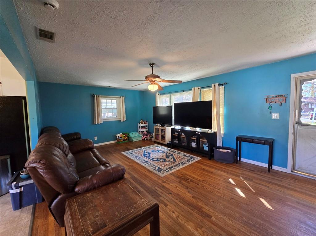 130 Trentwood Place Northwest Rome, GA 30165 - Photo 3 of 15 a living room with furniture and a flat screen tv