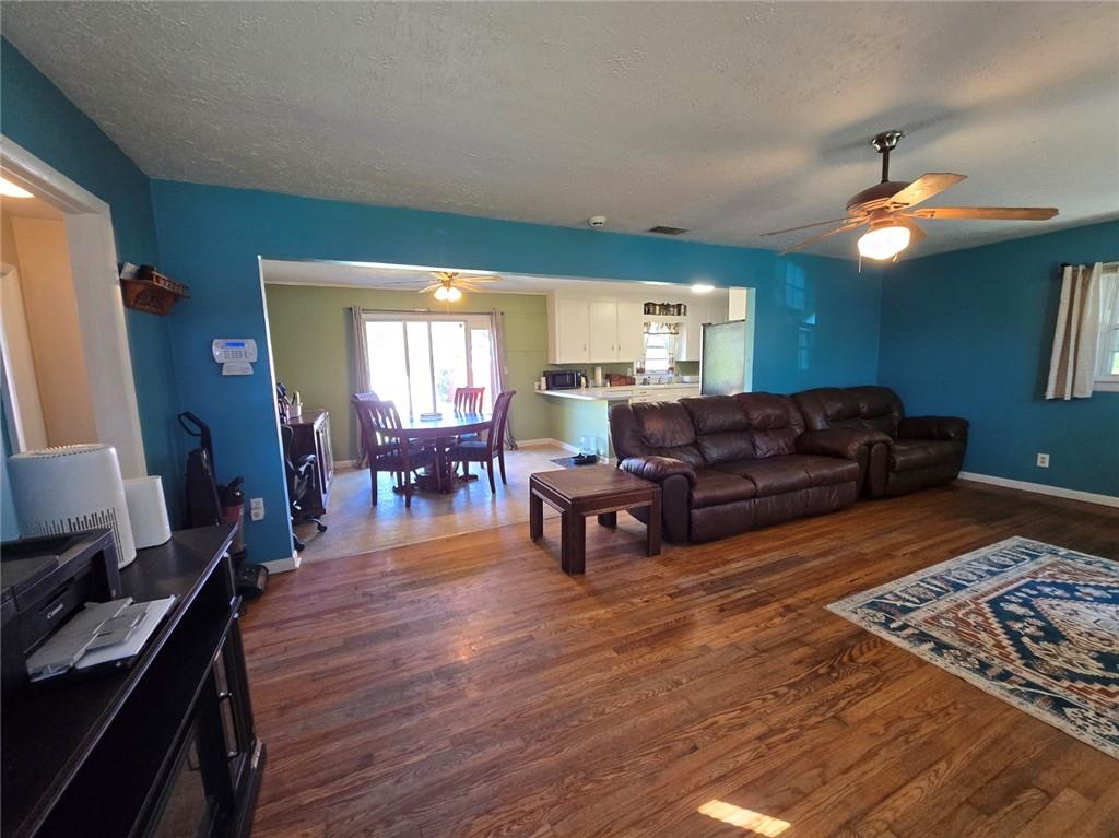 130 Trentwood Place Northwest Rome, GA 30165 - Photo 5 of 15 a living room with furniture and wooden floor