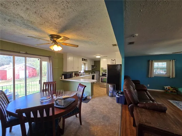 a view of a dining room with furniture window and outside view