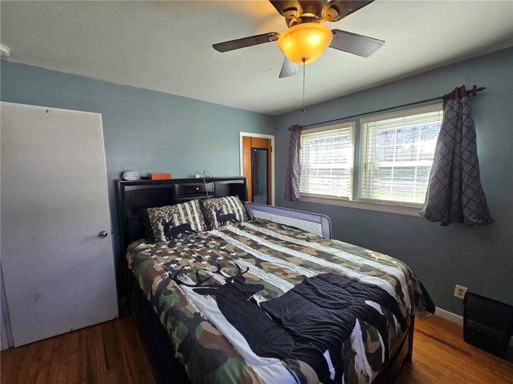 130 Trentwood Place Northwest Rome, GA 30165 - Photo 9 of 15 a bedroom with a bed and a chandelier