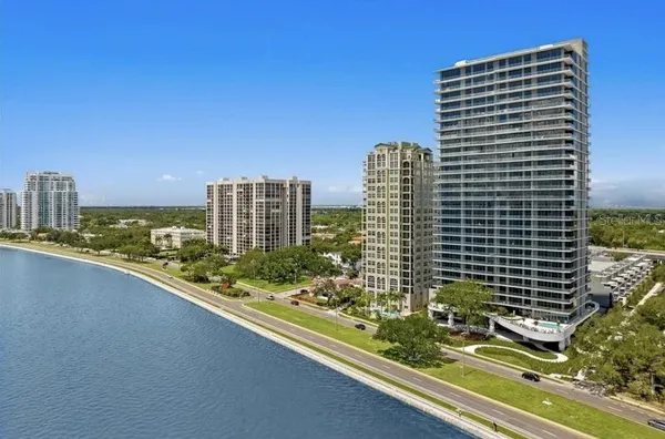 a view of balcony with a tall buildings