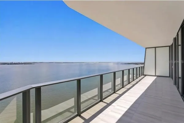 a view of balcony with furniture