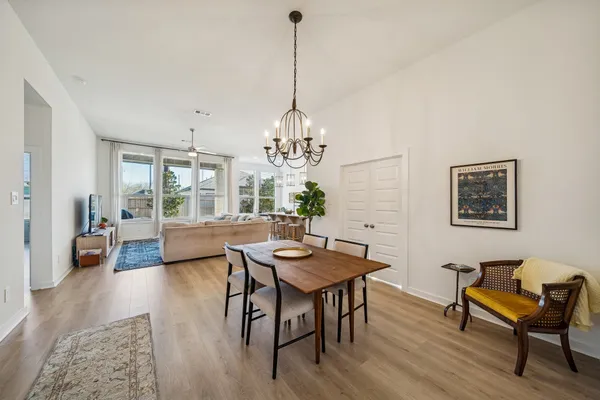 a dining room with furniture and window