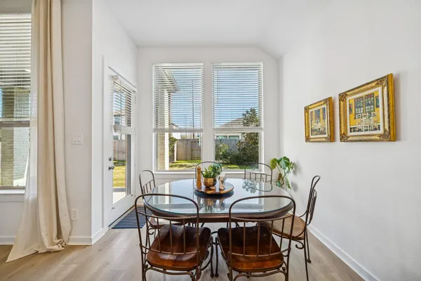 a view of a house with backyard porch and sitting area