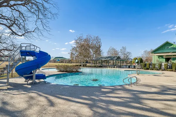 a view of a swimming pool and an outdoor space