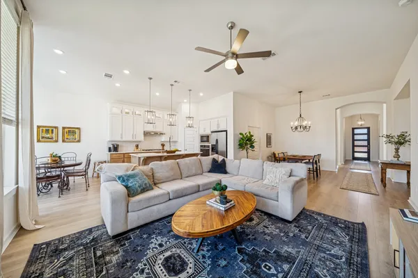 a living room with furniture and a rug