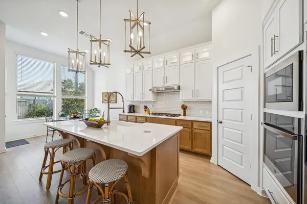 a kitchen with appliances cabinets and a sink