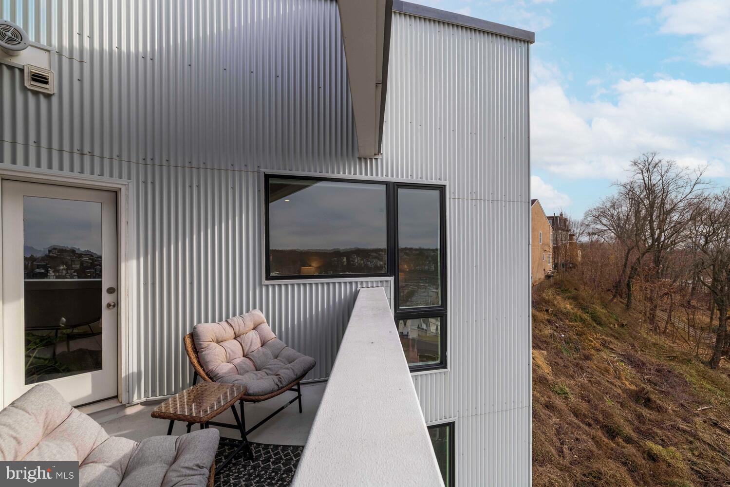 237 Krams Avenue Philadelphia, PA 19128 - Photo 15 of 31 a view of balcony and couch