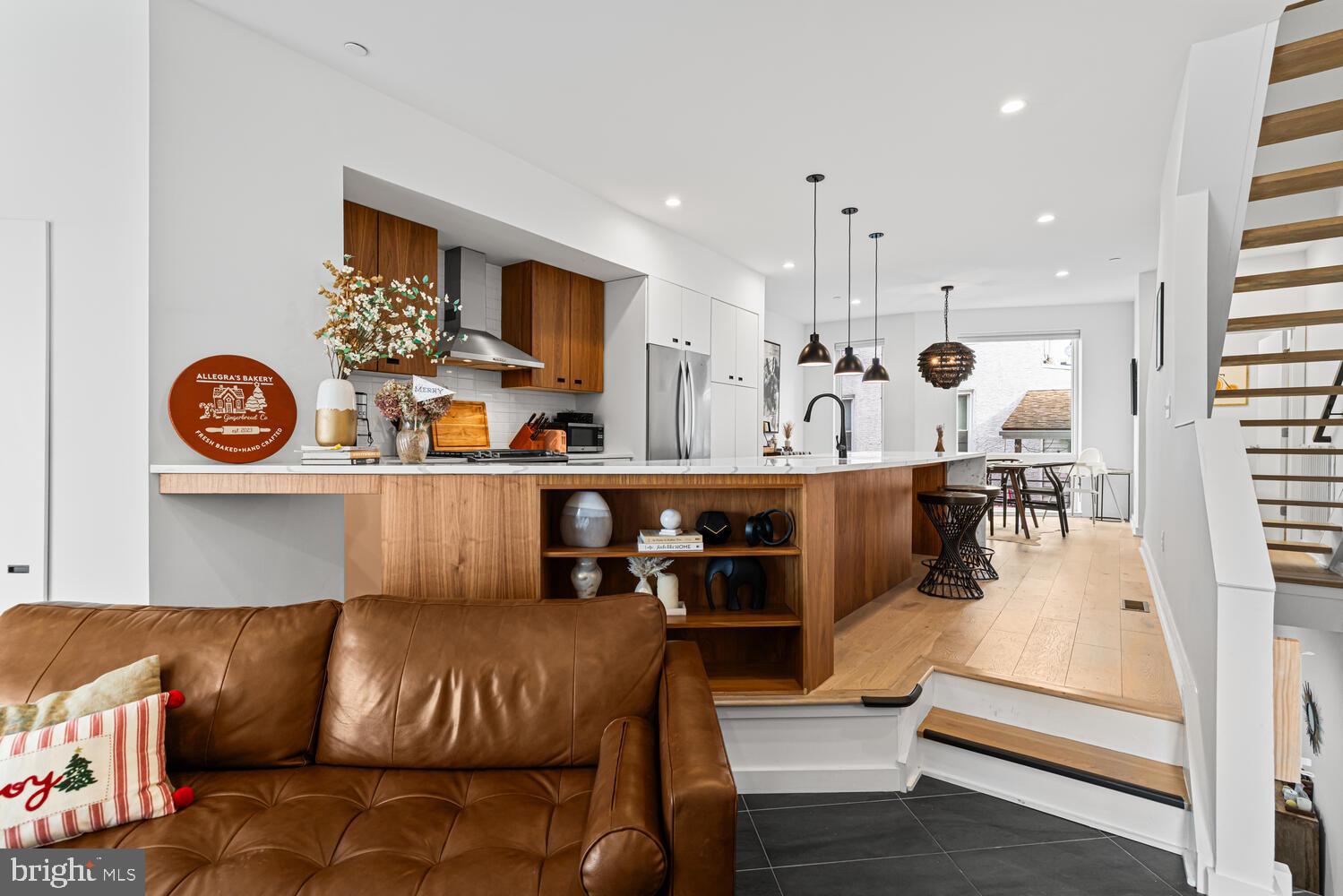 237 Krams Avenue Philadelphia, PA 19128 - Photo 2 of 31 a living room with furniture and kitchen view