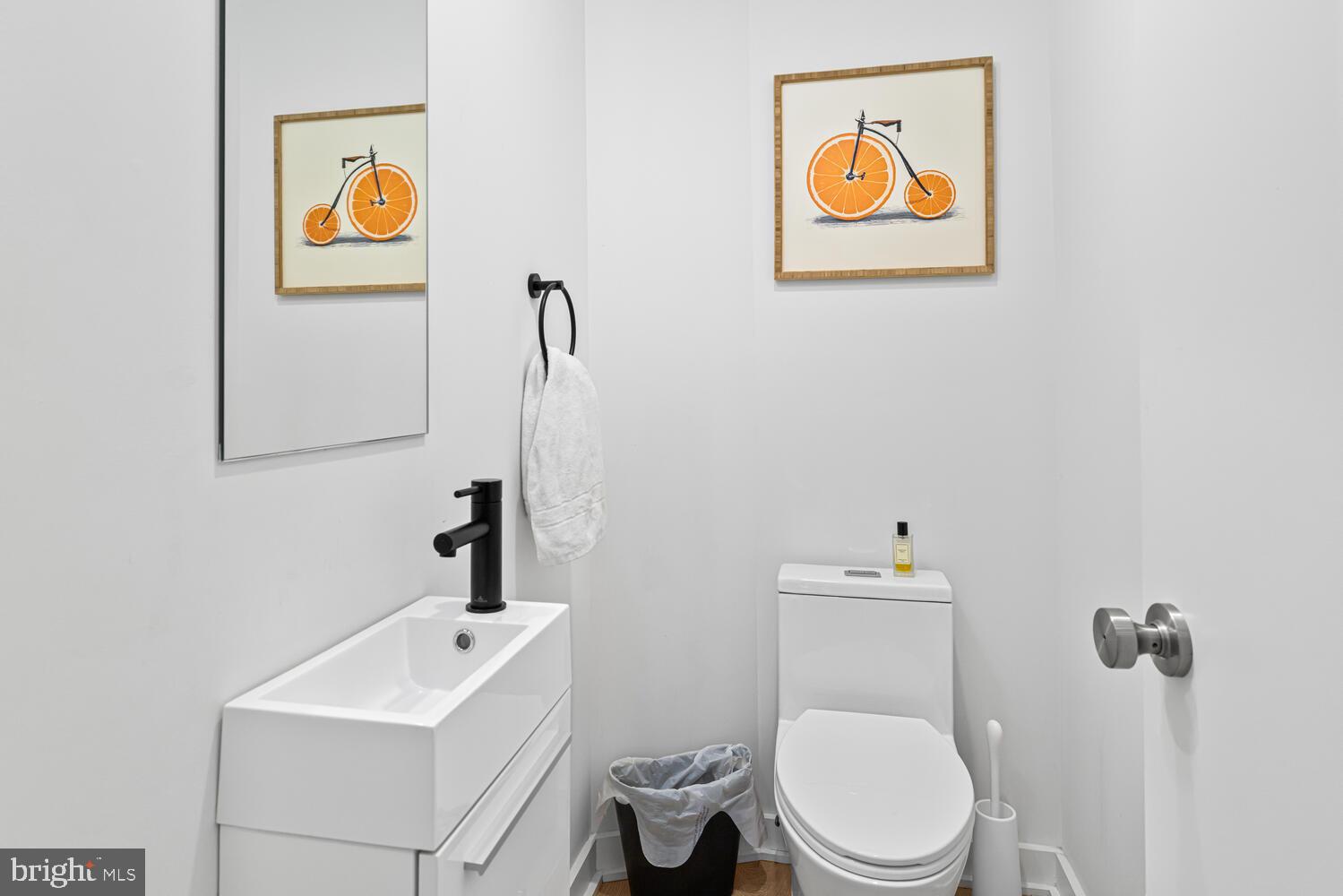 237 Krams Avenue Philadelphia, PA 19128 - Photo 24 of 31 a bathroom with a toilet a sink and mirror