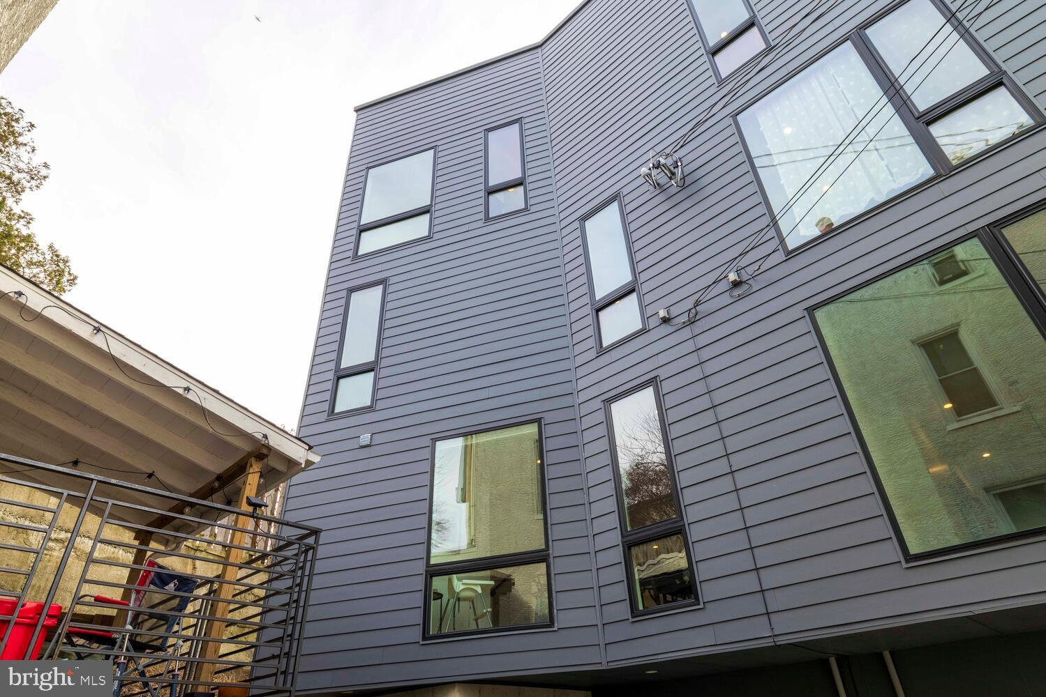 237 Krams Avenue Philadelphia, PA 19128 - Photo 25 of 31 a view of a brick house with windows