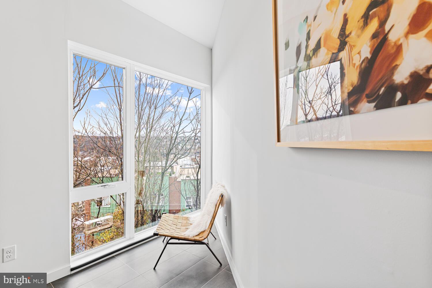 237 Krams Avenue Philadelphia, PA 19128 - Photo 31 of 31 a view of a room that has a bench and a painting on the wall