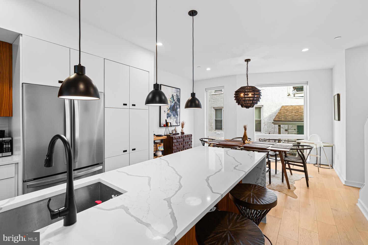 237 Krams Avenue Philadelphia, PA 19128 - Photo 5 of 31 a large kitchen with a table and chairs