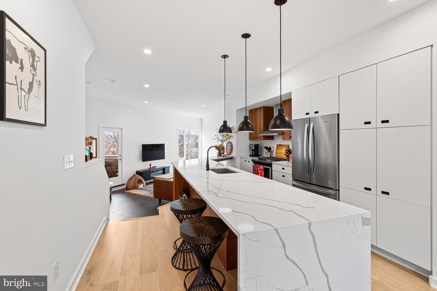 237 Krams Avenue Philadelphia, PA 19128 - Photo 6 of 31 a room with furniture and a flat screen tv