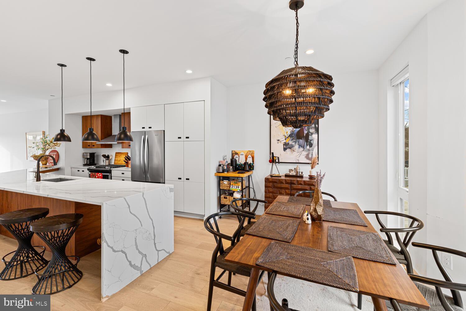 237 Krams Avenue Philadelphia, PA 19128 - Photo 7 of 31 a dining room table chairs and a chandelier