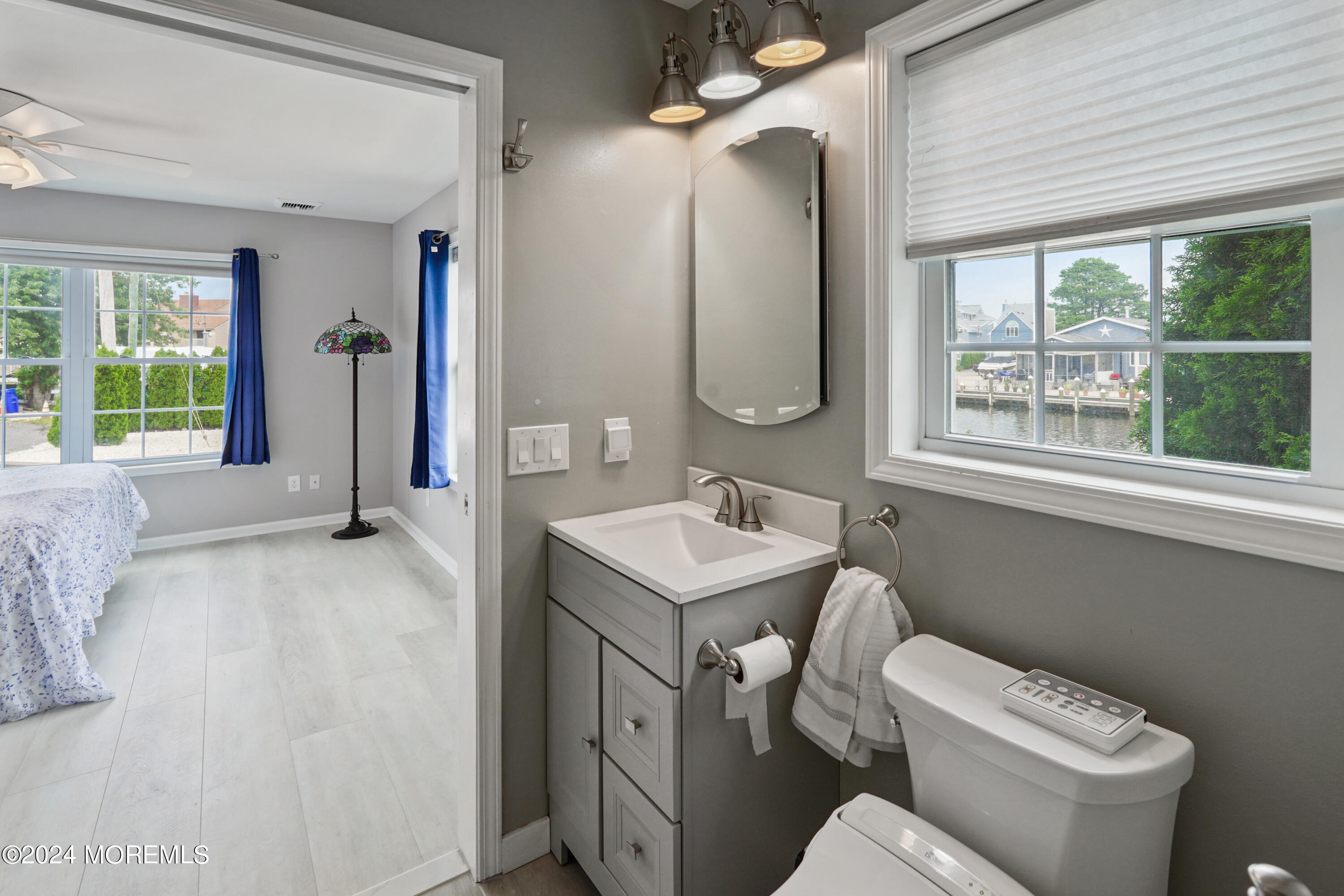 2 Topsail Road Brick, NJ 08723 - Photo 19 of 69 a bathroom with a toilet sink and mirror