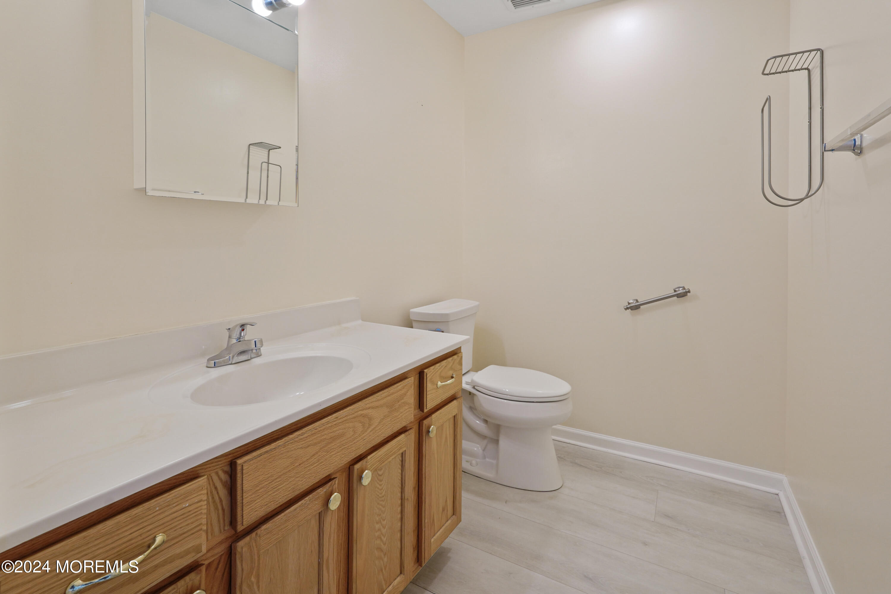 2 Topsail Road Brick, NJ 08723 - Photo 22 of 69 a bathroom with a granite countertop sink a toilet and with shower