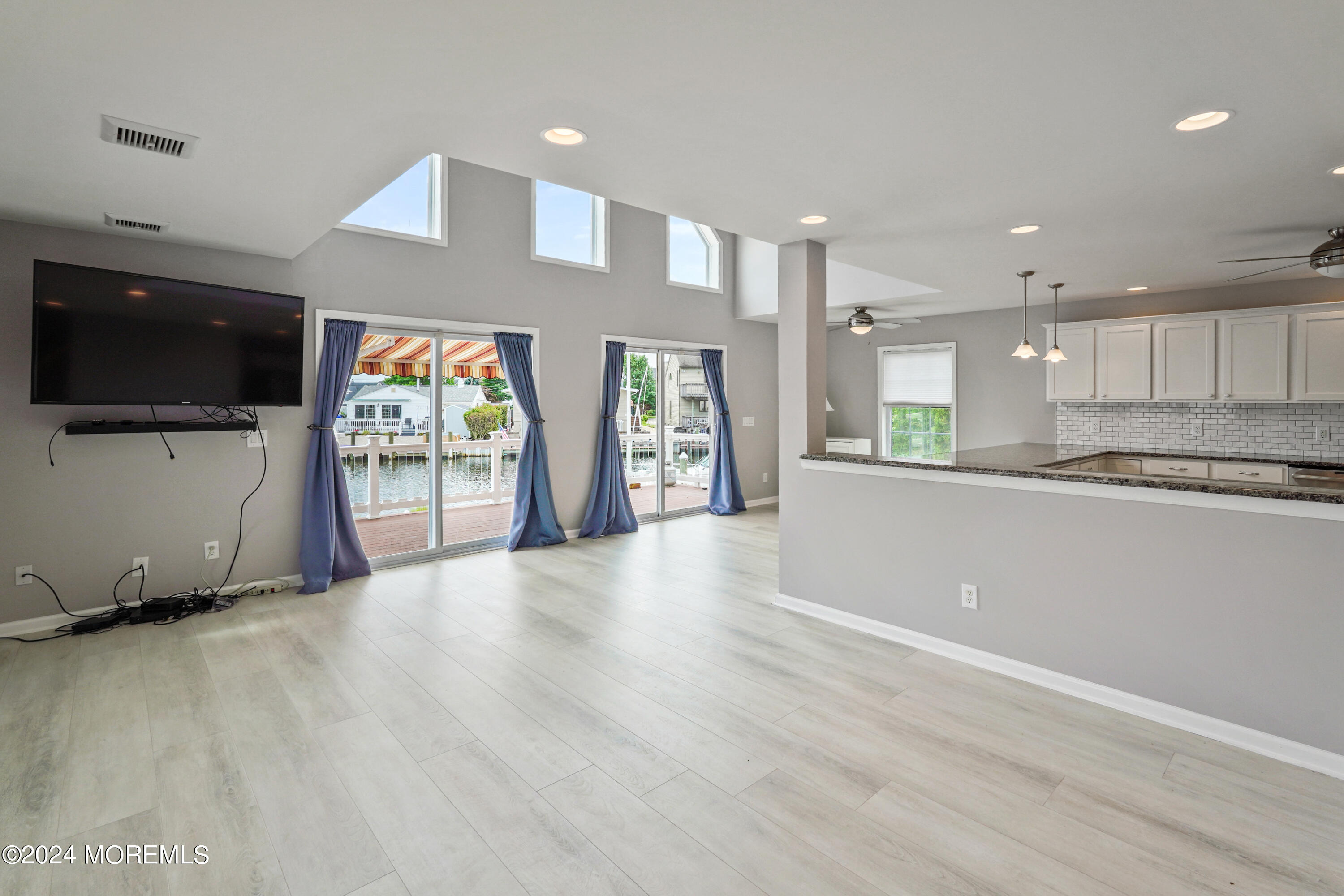 2 Topsail Road Brick, NJ 08723 - Photo 32 of 69 a view of an empty room with a kitchen and a window