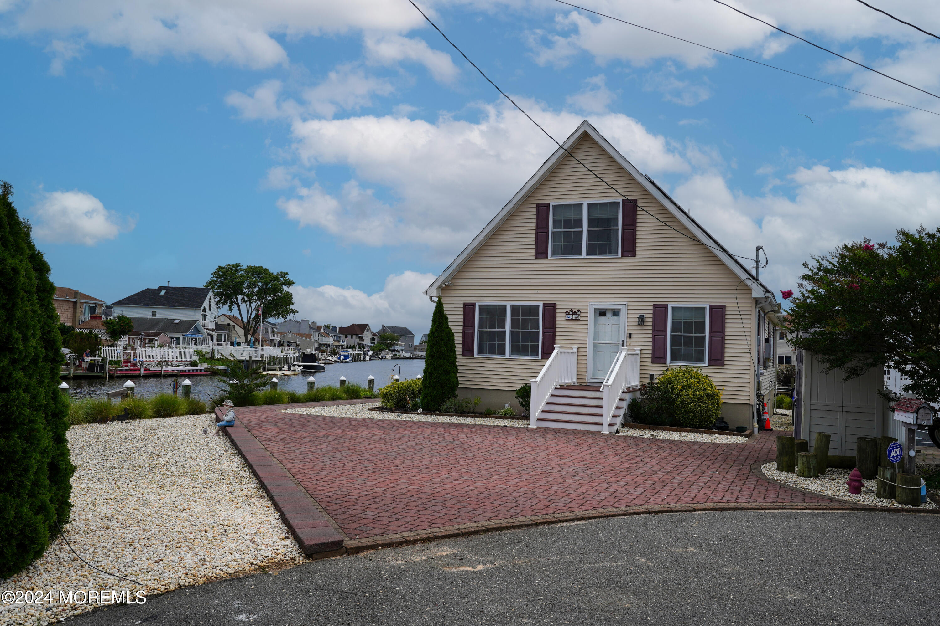 2 Topsail Road Brick, NJ 08723 - Photo 35 of 69 a front view of a house with a yard and garage