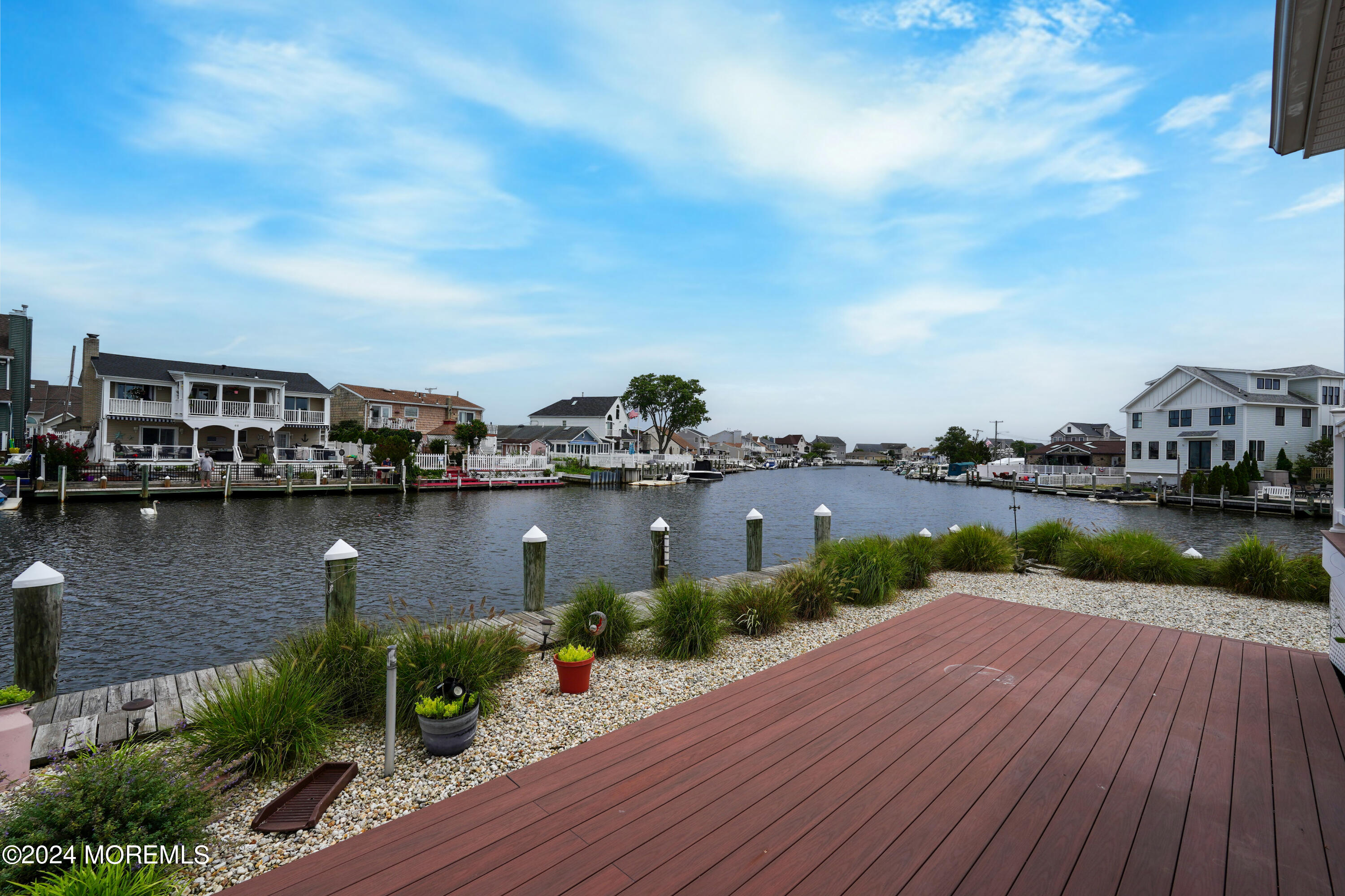 2 Topsail Road Brick, NJ 08723 - Photo 50 of 69 a view of a lake with boats and trees in the background