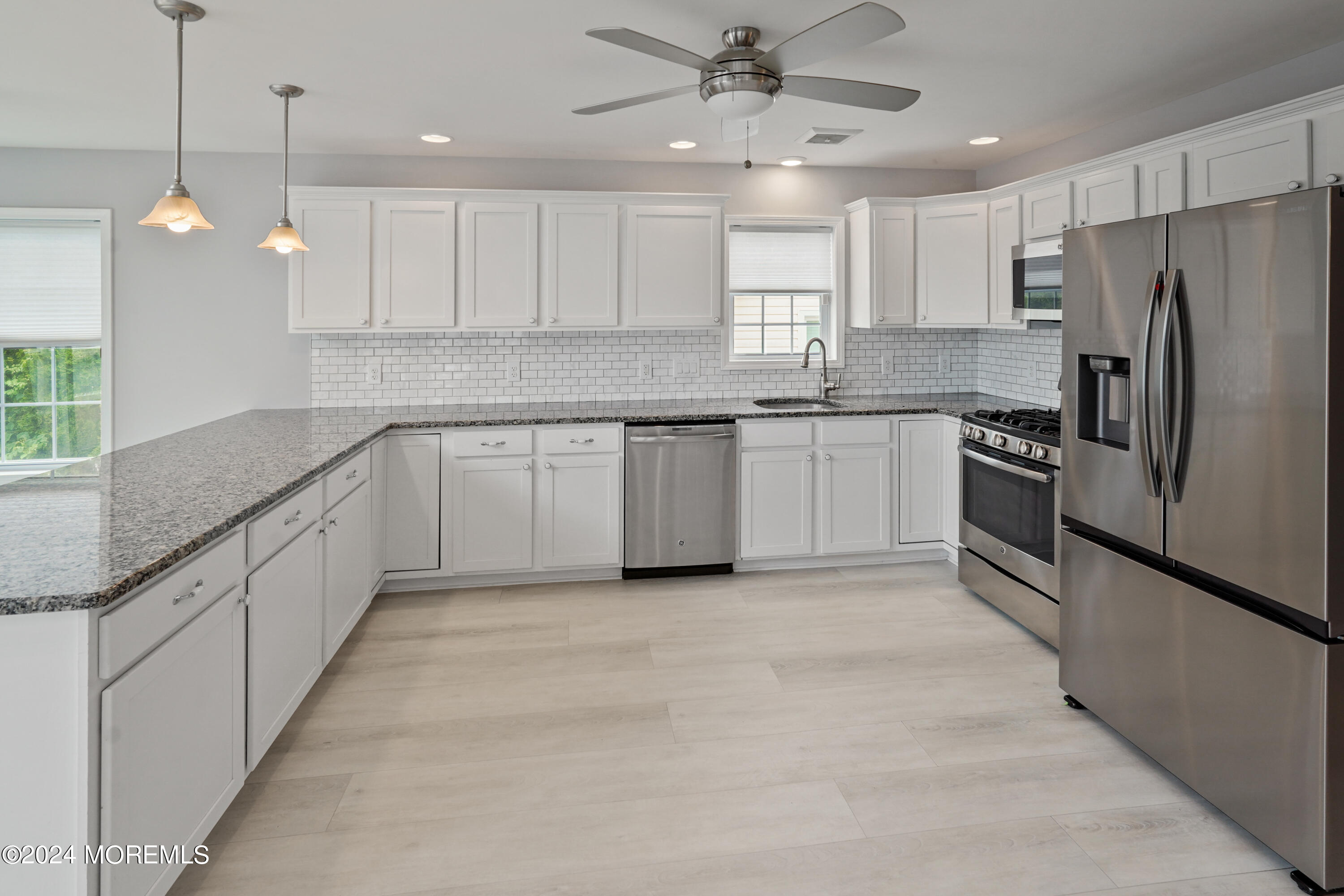 2 Topsail Road Brick, NJ 08723 - Photo 5 of 69 a kitchen with granite countertop stainless steel appliances and white cabinets