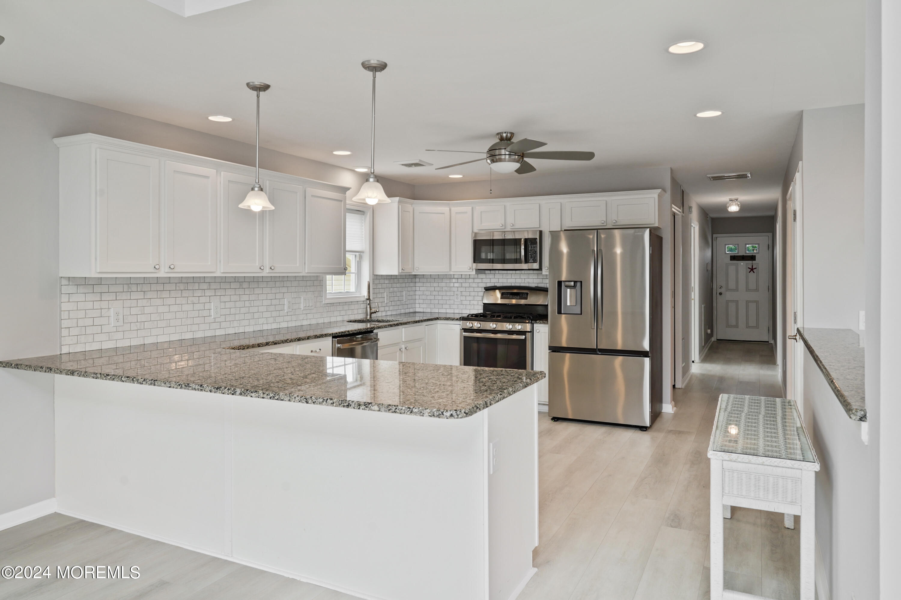 2 Topsail Road Brick, NJ 08723 - Photo 7 of 69 a kitchen with stainless steel appliances granite countertop a sink a stove and a refrigerator