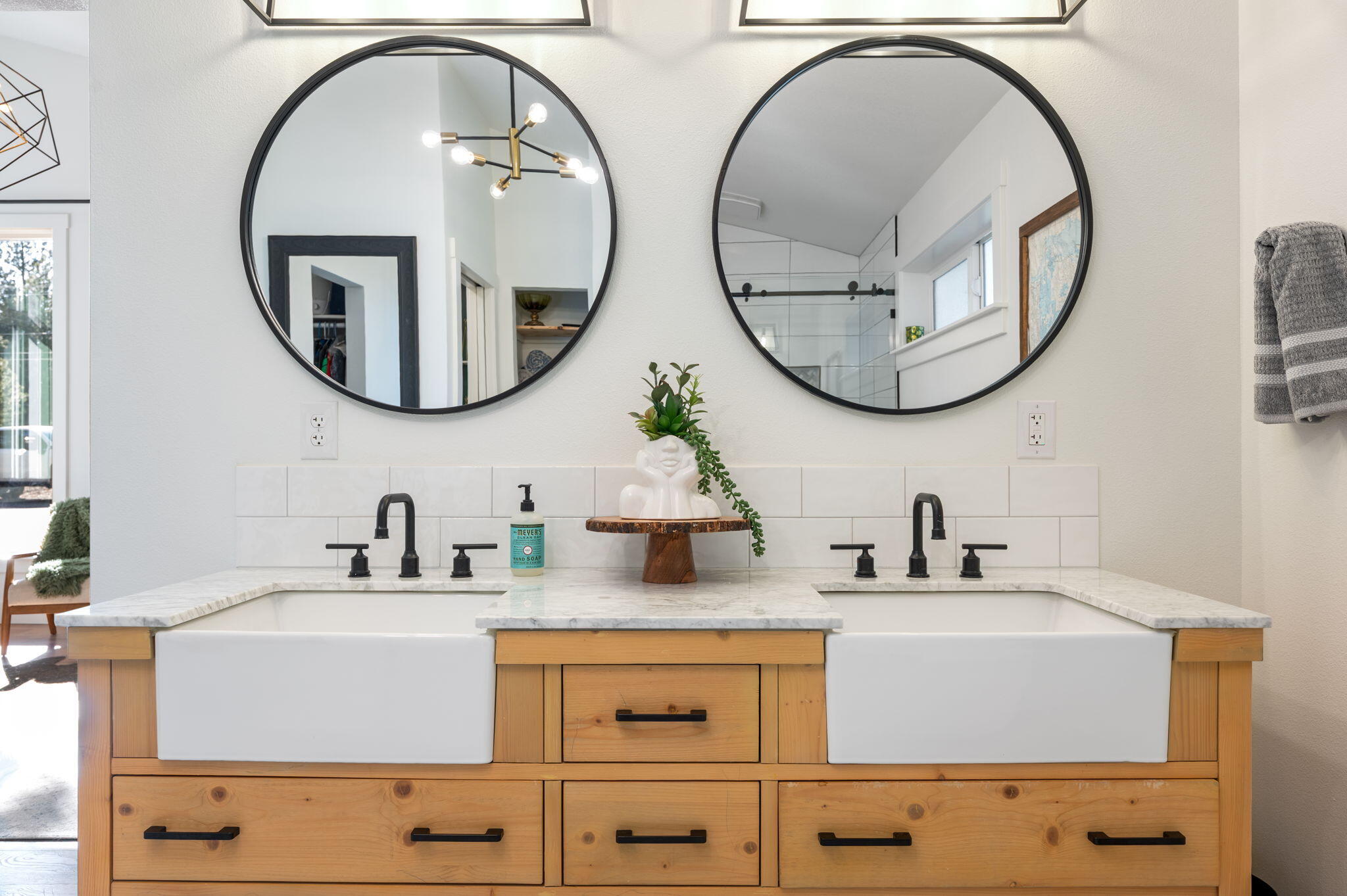 60072 Cinder Butte Road Bend, OR 97702 - Photo 37 of 60 a bathroom with a sink and a mirror