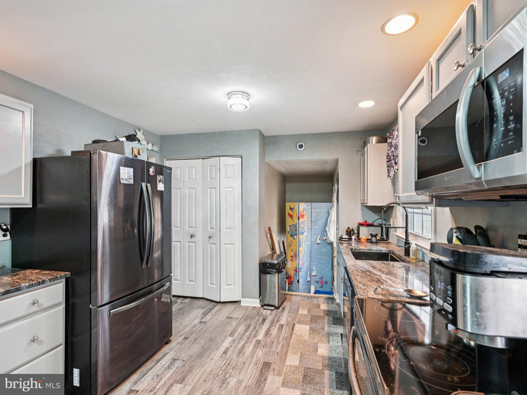 170 Scottfield Drive Newark, DE 19713 - Photo 10 of 28 a kitchen with stainless steel appliances granite countertop a refrigerator stove and microwave