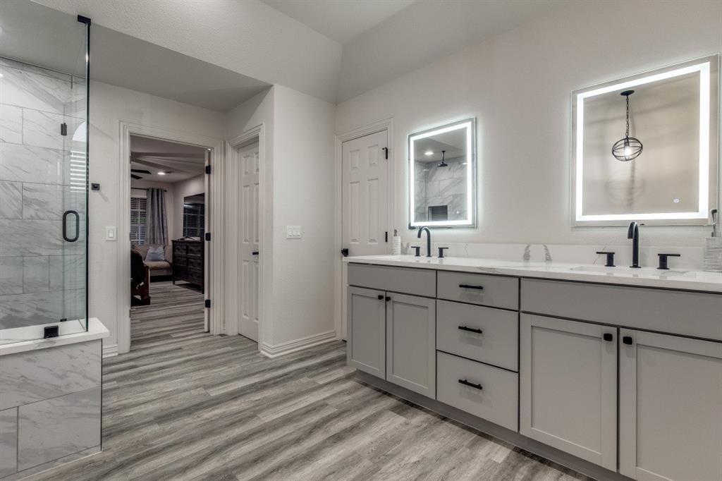 3304 Inwood Road Dallas, TX 75235 - Photo 16 of 24 a en suite bathroom with double sink and shower