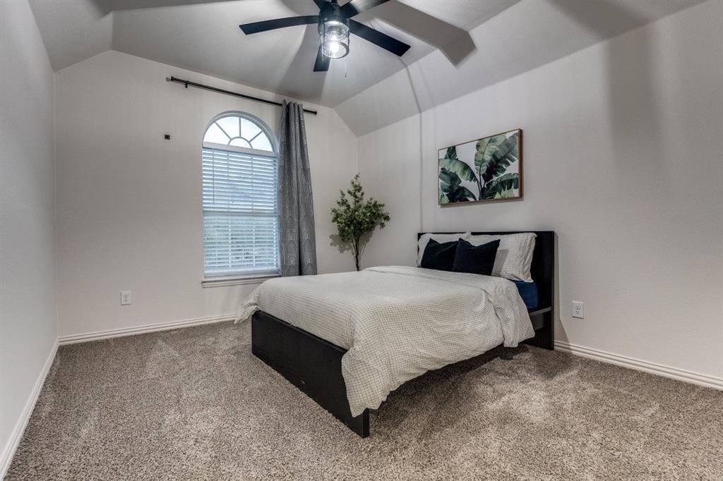 3304 Inwood Road Dallas, TX 75235 - Photo 17 of 24 a bedroom with a large bed and a window