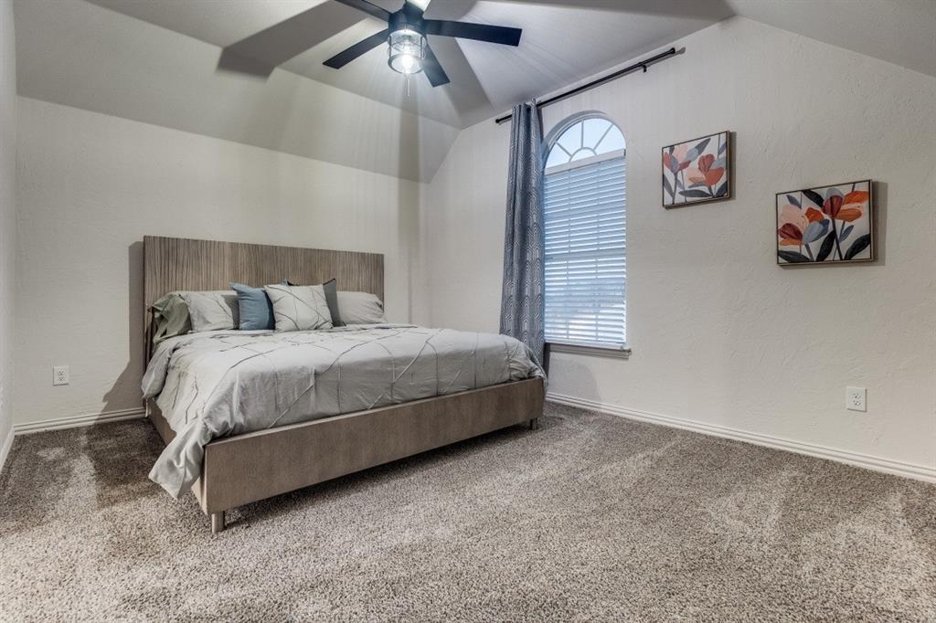 3304 Inwood Road Dallas, TX 75235 - Photo 19 of 24 a bedroom with a bed and a wall painting