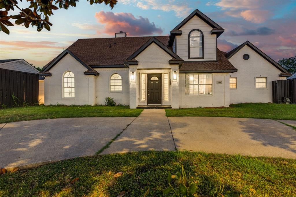3304 Inwood Road Dallas, TX 75235 - Photo 2 of 24 a front view of a house with a yard and garage