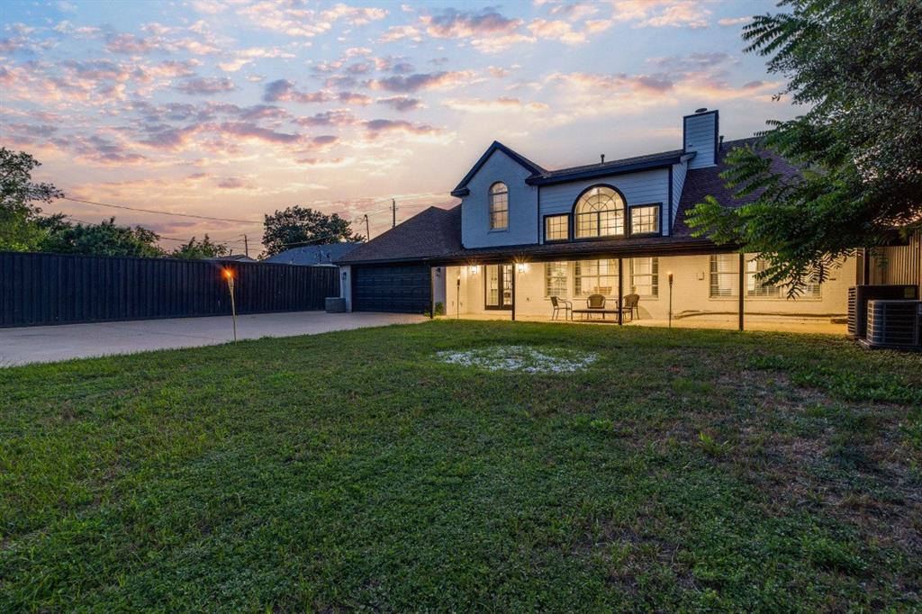 3304 Inwood Road Dallas, TX 75235 - Photo 23 of 24 a view of a house with a yard and a porch