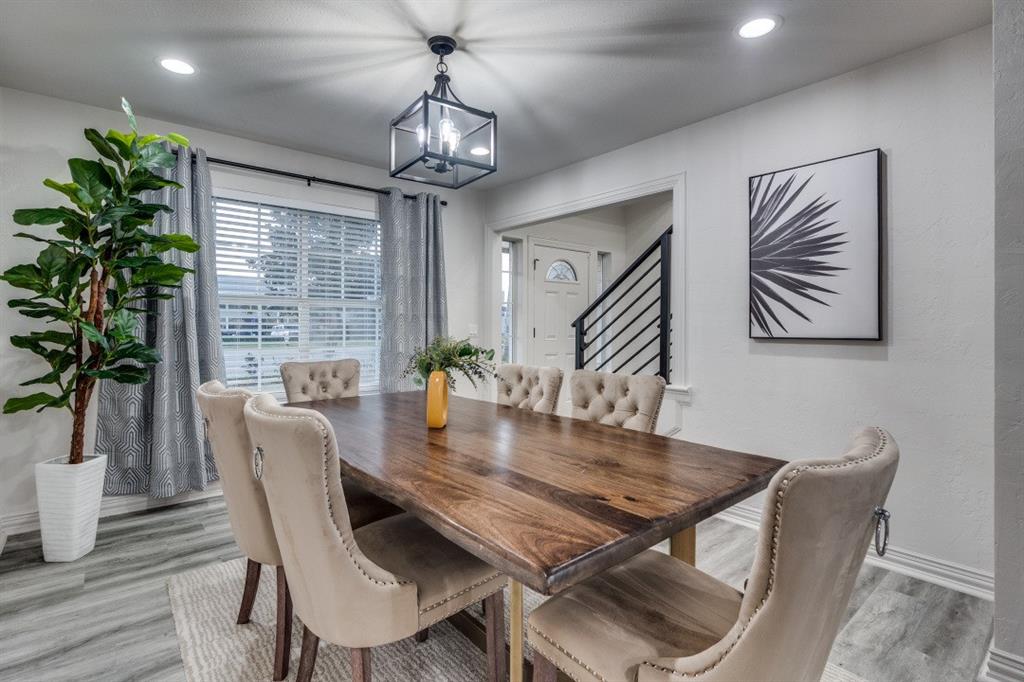 3304 Inwood Road Dallas, TX 75235 - Photo 6 of 24 a view of a dining room with furniture window and wooden floor
