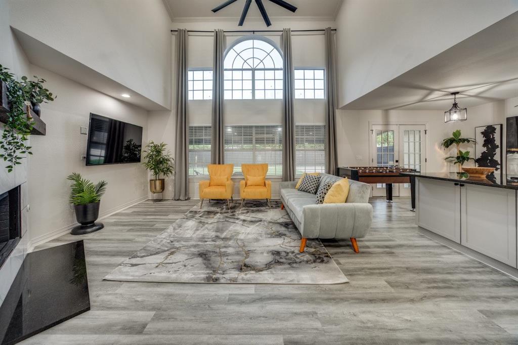 3304 Inwood Road Dallas, TX 75235 - Photo 7 of 24 a living room with furniture and a flat screen tv