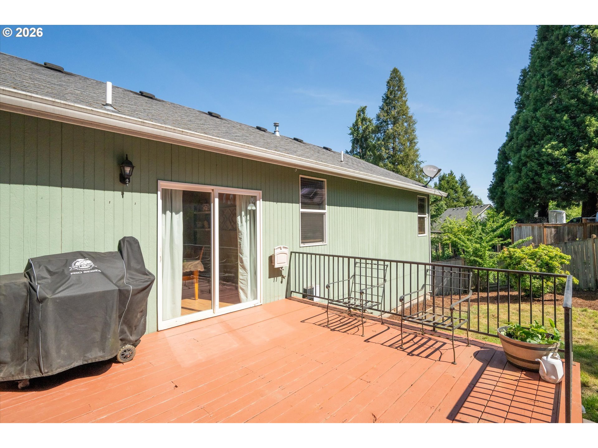 277 South 67th Court Springfield, OR 97478 - Photo 30 of 44 a view of a deck with couches chairs and wooden floor