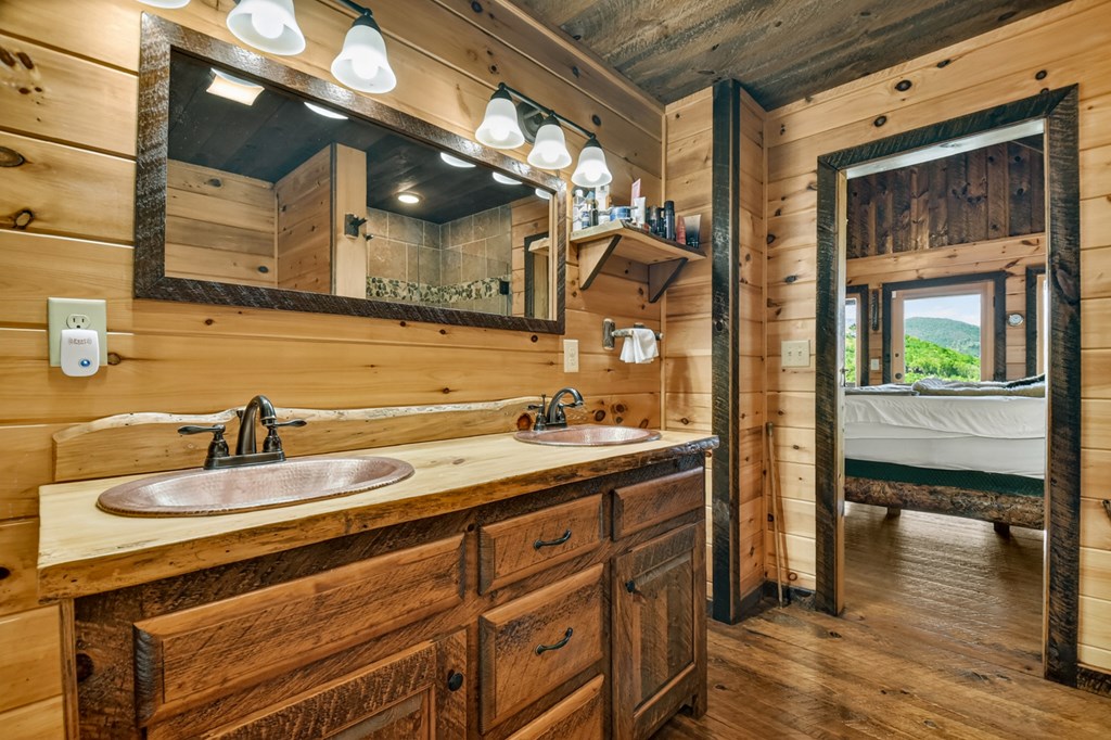 459 Quail Ridge Road Epworth, GA 30541 - Photo 58 of 73 a bathroom with a sink and a mirror