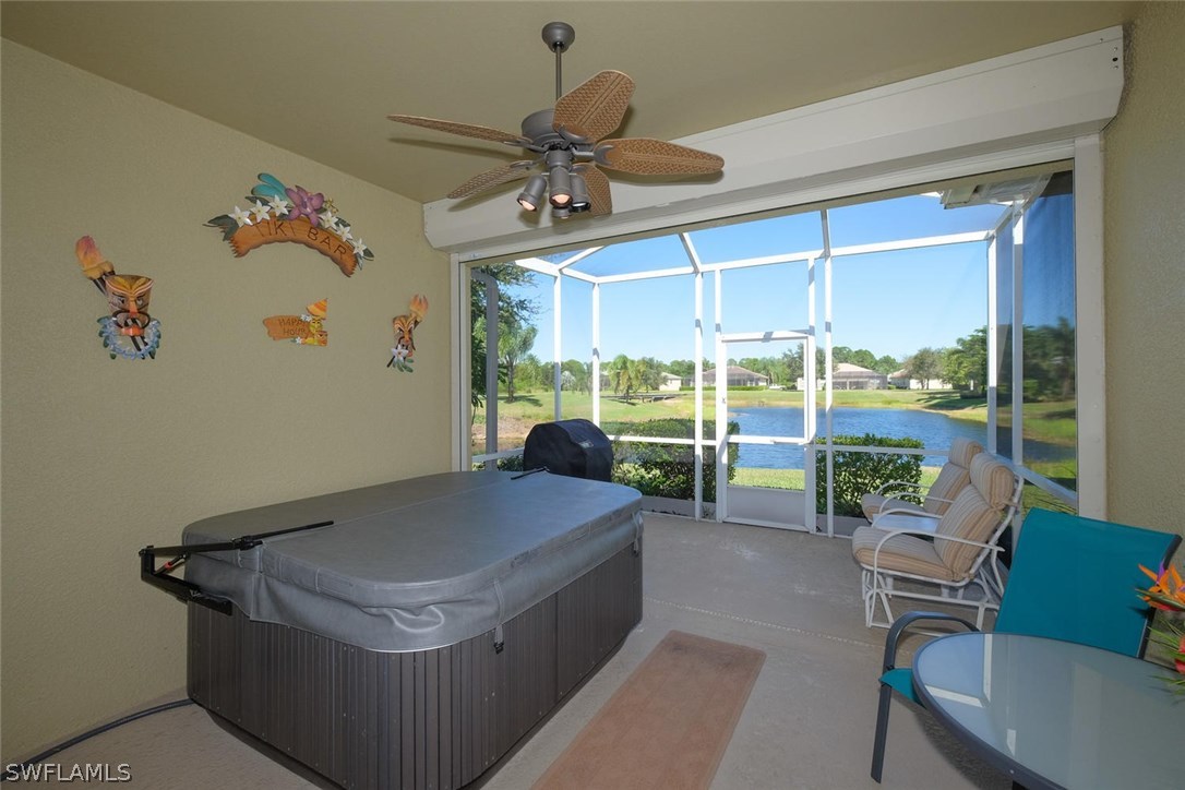 4664 Fairloop Run Lehigh Acres, FL 33973 - Photo 19 of 24 a living room with a large window with pool table and chairs