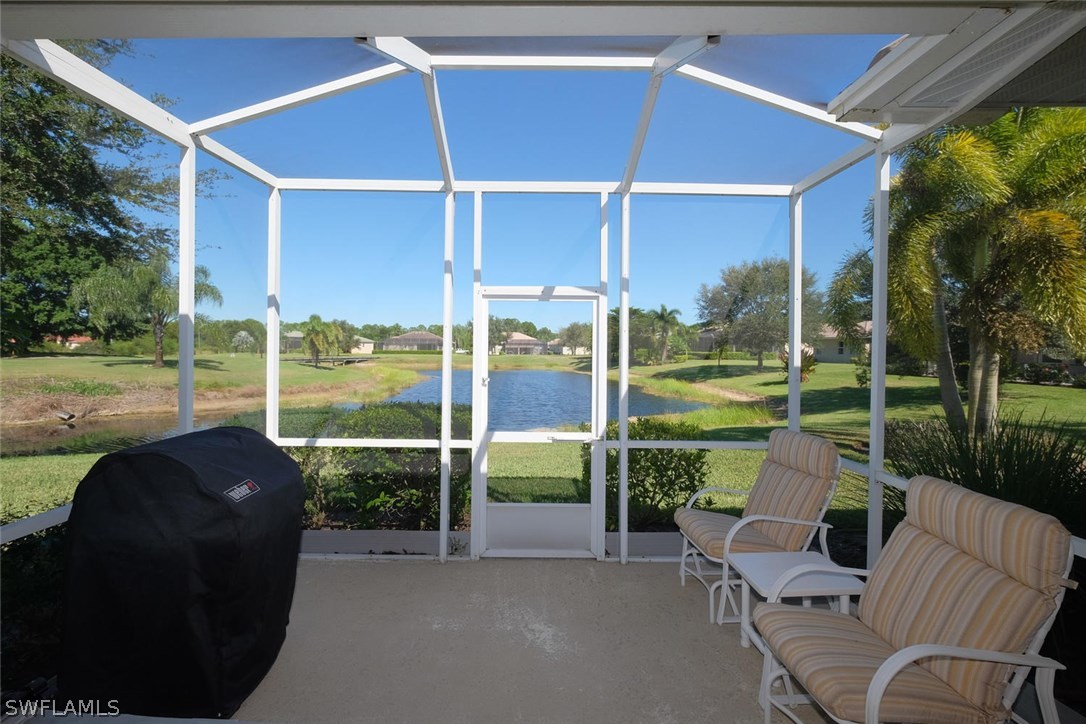 4664 Fairloop Run Lehigh Acres, FL 33973 - Photo 20 of 24 a view of a chair and tables in the patio