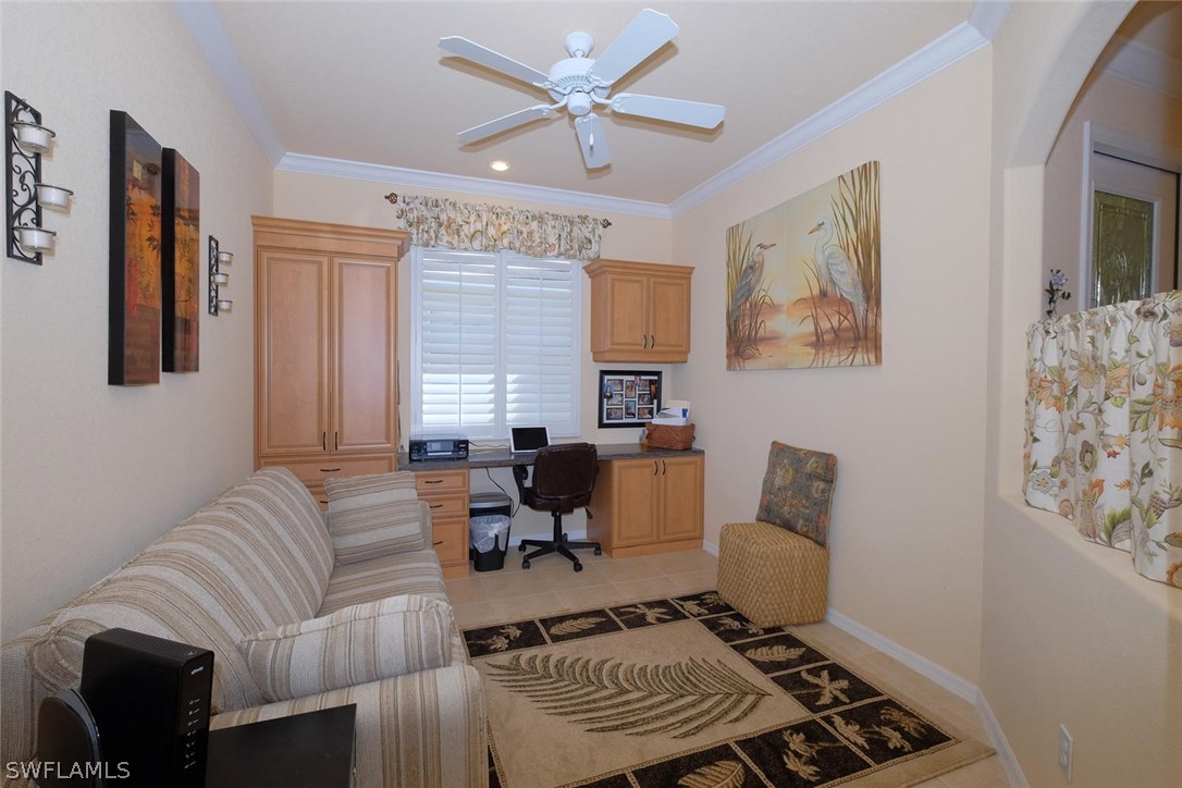 4664 Fairloop Run Lehigh Acres, FL 33973 - Photo 2 of 24 a living room with furniture and a window