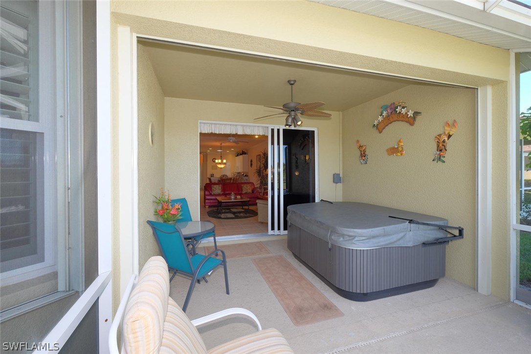 4664 Fairloop Run Lehigh Acres, FL 33973 - Photo 21 of 24 a living room with furniture and a window
