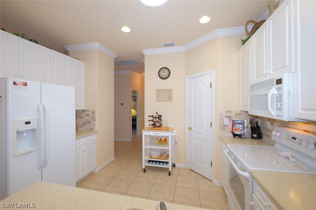 4664 Fairloop Run Lehigh Acres, FL 33973 - Photo 9 of 24 a bathroom with a sink a tub and a shower