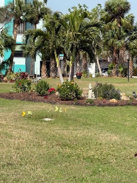 1868 Shore Drive South, Unit 608 South Pasadena, FL 33707 - Photo 25 of 36 a front view of a house with garden