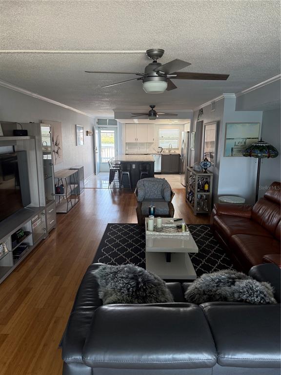 1868 Shore Drive South, Unit 608 South Pasadena, FL 33707 - Photo 9 of 36 a living room with furniture and a flat screen tv