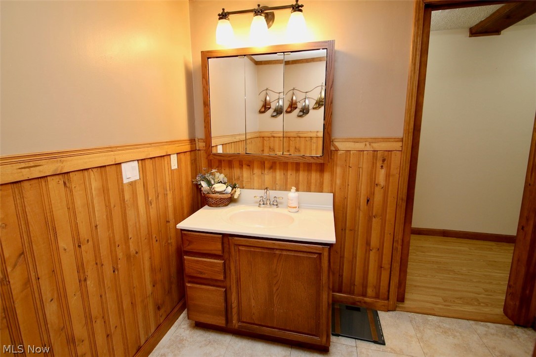 3 Nepahwin Road Timberlake, OH 44095 - Photo 17 of 22 Second full bath has character knotty pine and updates that go with the charm.